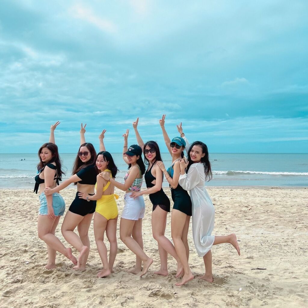 Travelers wearing swimwear and beach outfits in Quy Nhon, Vietnam